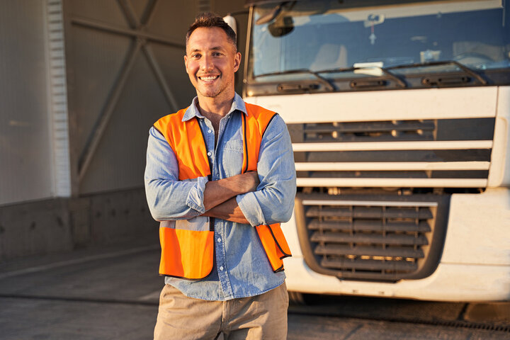 Truck driver focused at the wheel of his commercial truck