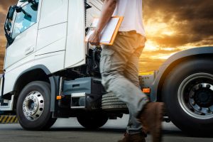 Fleet of commercial trucks representing the trucking industry workforce