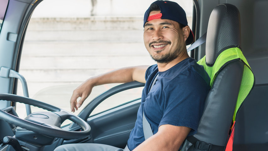 Truck driving on a highway representing safe commercial vehicle operation