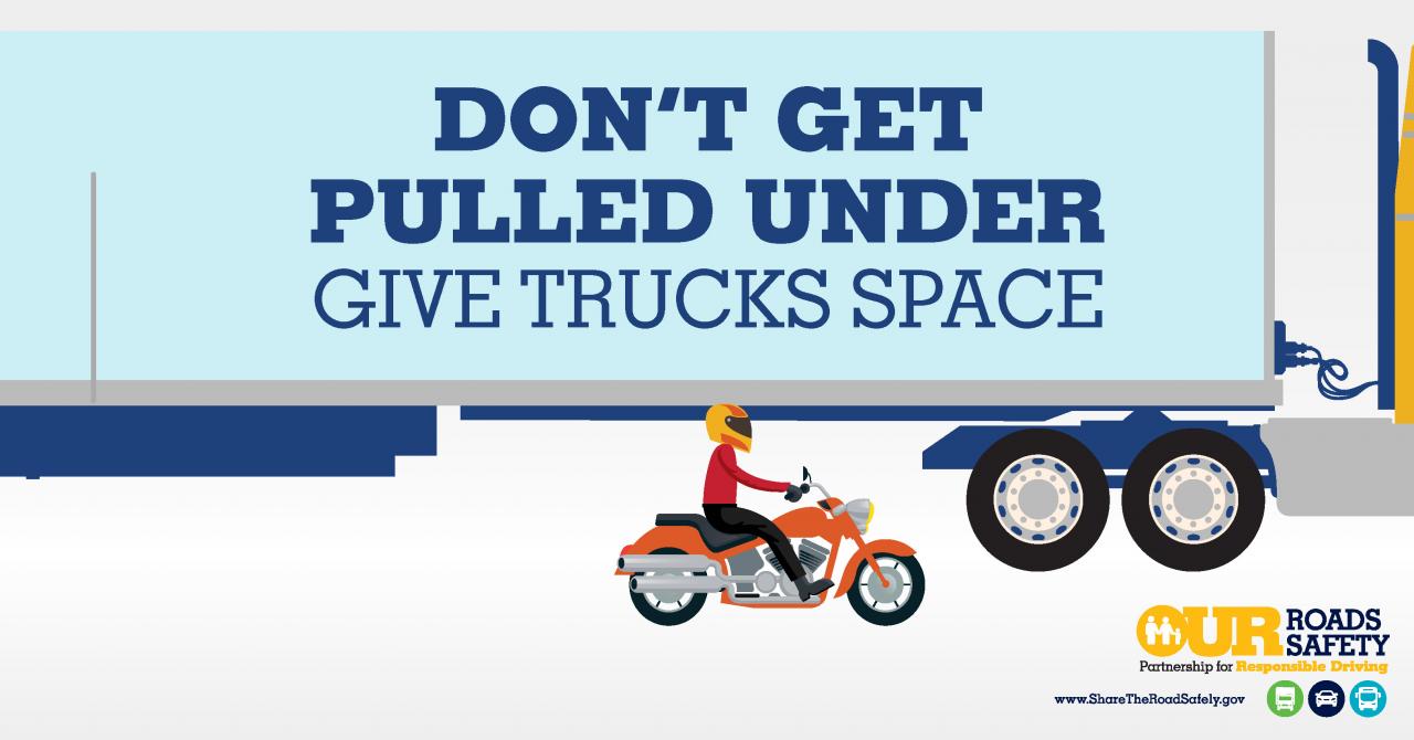 Photo showing the dramatic size difference between trucks and passenger vehicles on the highway